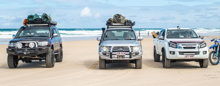 Cars parked on Fraser Island Beach